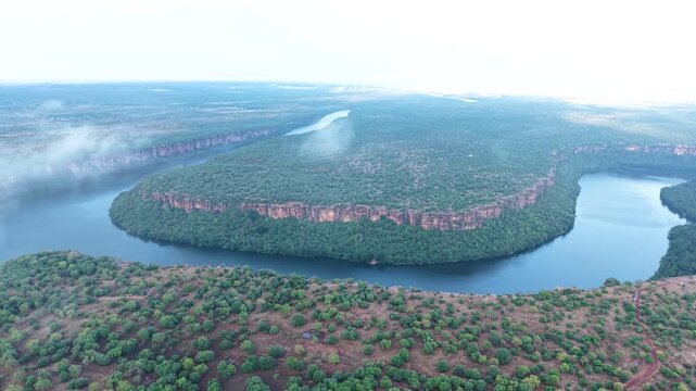 Aerial drone shot of Jawahar Sagar Sanctuary along Chambal River in Rajasthan India, showcasing natural landscape, river flow and protected wildlife habitat.