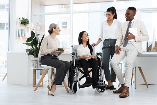 Woman, team and wheelchair in office meeting with smile, talk and review notes at insurance company. Person with disability, broker and discussion for feedback, happy and group risk management agency