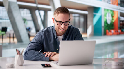 Fototapeta premium Confident Businessman Leading Online Seminar From Laptop