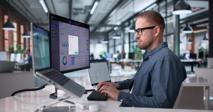 Young Professional Managing Cloud-Based Enterprise Software System