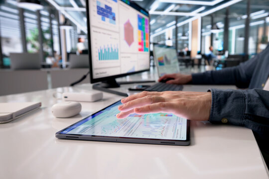 Business Analyst Reviews Market Data On Computer