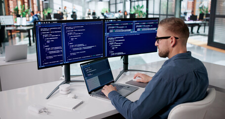 Obraz na płótnie Canvas Focused Programmer Developing Innovative Software