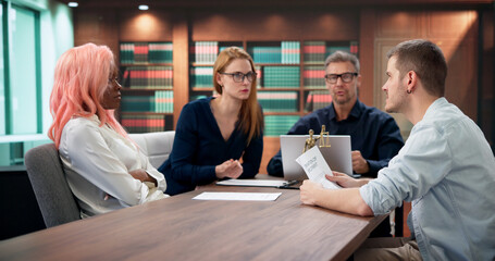 Family Divorce Lawyer Advises Young Couple During Important Legal Meeting