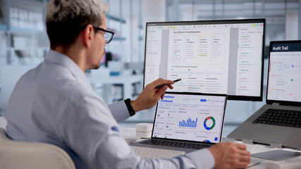Hispanic Man Reviewing And Approving Documents With Cloud-Based Checklist