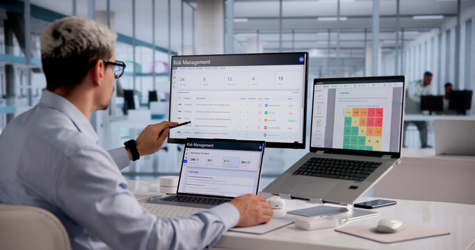 Hispanic Business Analyst Evaluating Cybersecurity Threats On Laptop