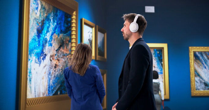 Young Couple Enjoying Audio Guide