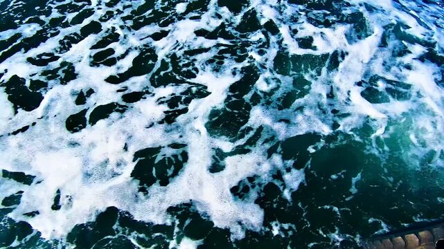 Foamy Boat Wake Moving Fast Across Water from Ferry View