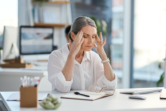 Headache, stress or woman in agency with pain, frustration or update mistake in task management. Tired, coworking or mature employee in office with migraine, brain fog or burnout in deadline pressure