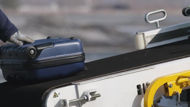 Airplane suitcases luggage baggage conveyor worker at airport terminal airline aircraft. Passengers boarding airplane.