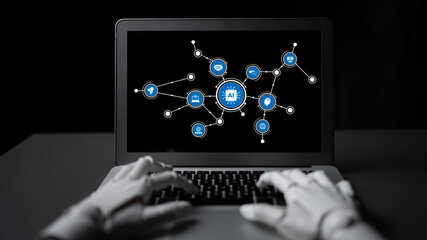 Fototapeta premium An engaging scene showcasing a laptop displaying artificial intelligence concepts with robotic hands typing. A modern representation of technology and connectivity. Tessel