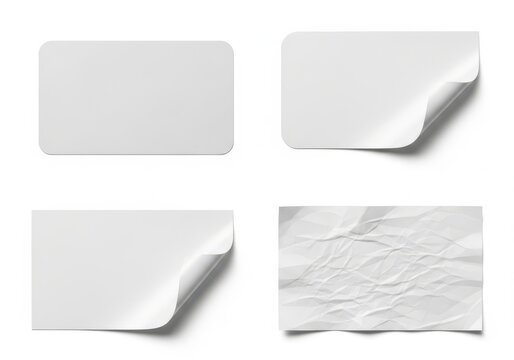 A set of four blank white sticky notes with different corners and textures on a plain background