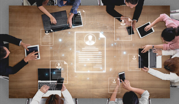 Concept of global talent acquisition and hiring. Human resources department reviewing candidate curriculum vitae and resumes for a job search and workforce selection process. Fermion