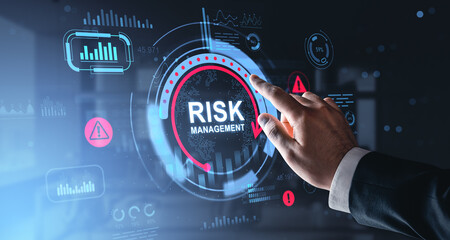 Fototapeta premium Digital risk management interface with hand interacting through futuristic dashboard elements highlighting warnings, analytics, and strategic control systems..