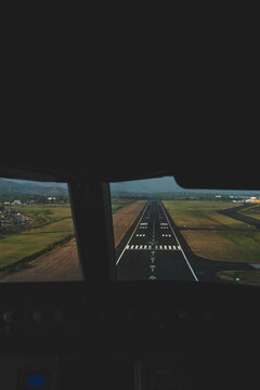 Airport runway seen from cockpit before landing