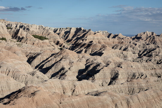 Expansive Badlands Landscape With Layered Rock Formations, Erosi