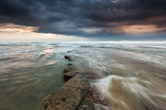 Dramatic Beach Landscape with Stormy Sky
