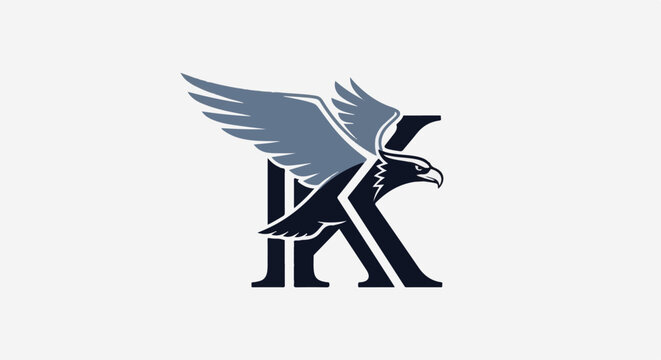 Dark eagle with grey wings perched on a dark capital letter K