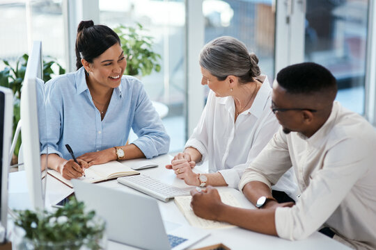 Business people, team and writing in notebook at office meeting, proposal or planning at insurance company. Man, women and happy with review, training and feedback report at risk management agency