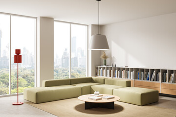 Fototapeta premium Modern minimalist interior living room with modular green sofa, large windows overlooking city skyline, stylish shelving and soft decor. 3D Rendering