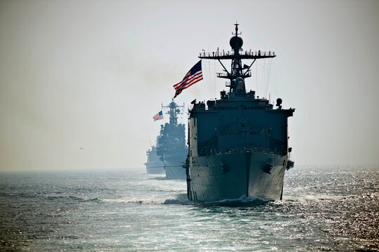 STRAIT OF HORMUZ U.S. Navy and Coast Guard ships participates in a photo exercise while transiting the Strait of Hormuz,  Sioux City is deployed to the U.S. 5th Fleet area of operations to help ensure