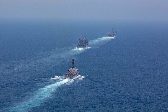 STRAIT OF HORMUZ U.S. Navy and Coast Guard ships participates in a photo exercise while transiting the Strait of Hormuz,  Sioux City is deployed to the U.S. 5th Fleet area of operations to help ensure