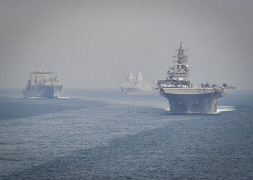 STRAIT OF HORMUZ U.S. Navy and Coast Guard ships participates in a photo exercise while transiting the Strait of Hormuz,  Sioux City is deployed to the U.S. 5th Fleet area of operations to help ensure