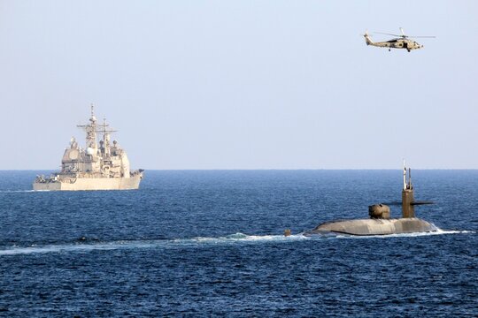 STRAIT OF HORMUZ U.S. Navy and Coast Guard ships participates in a photo exercise while transiting the Strait of Hormuz,  Sioux City is deployed to the U.S. 5th Fleet area of operations to help ensure