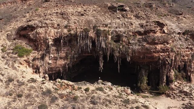 Aerial view flying over hoq cave entrance on socotra island, yemen