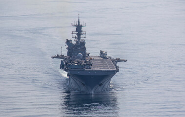 STRAIT OF HORMUZ U.S. Navy and Coast Guard ships participates in a photo exercise while transiting the Strait of Hormuz,  Sioux City is deployed to the U.S. 5th Fleet area of operations to help ensure © Mubin