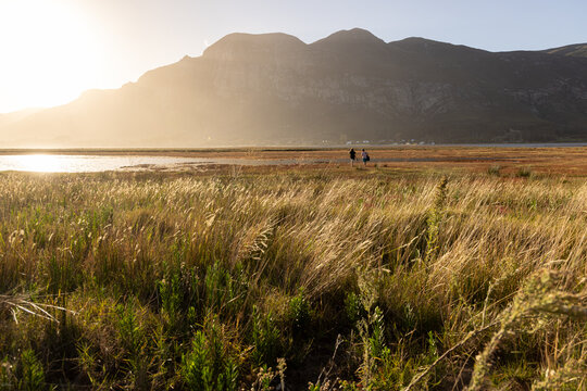 sunlight over lagoon looking toward Klein Mountains, Stanford, South Africa