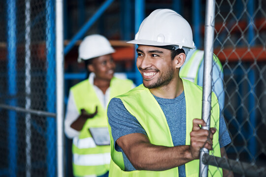 Preparation, smile or man on construction site with gate, shift setup or activation in morning. Happy, people or contractor at industrial area with entrance, ppe or opening deployment at start of day