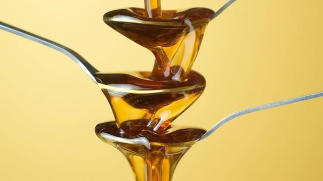 Creative conceptual shot of maple syrup and spoons