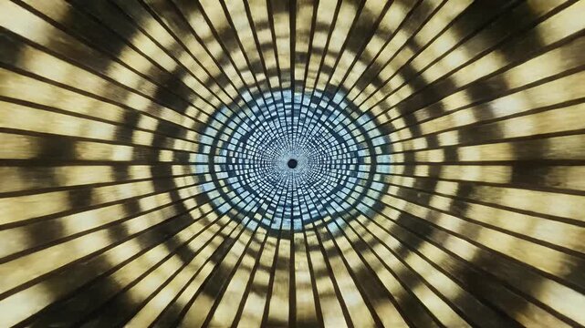 A mesmerizing radial pattern emanates from a central point, showcasing a blend of purple and gray hues.