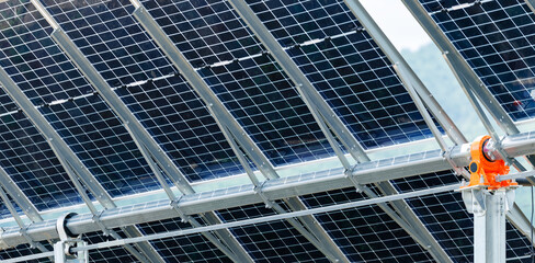 Close-up of solar panels: renewable energy technology with metal framework in detail, Automatic sun tracking system © Parilov