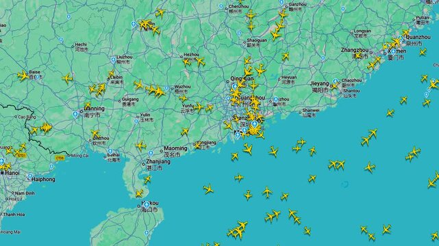 Air traffic map over South China showing dense flight routes, real time aviation tracking with multiple aircraft icons over coastal region