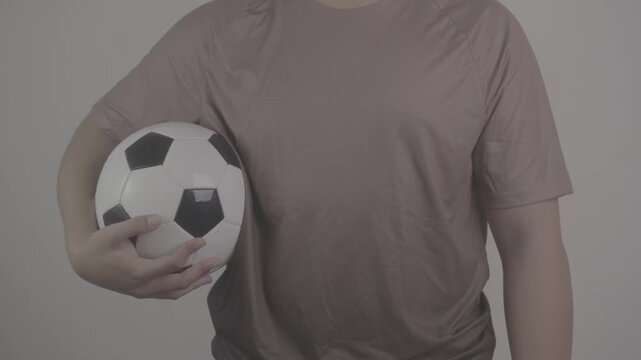 close up shot of a person wearing a brown jersey, carrying a ball at his side with full confidence S-Log3, S-Gamut3.Cine