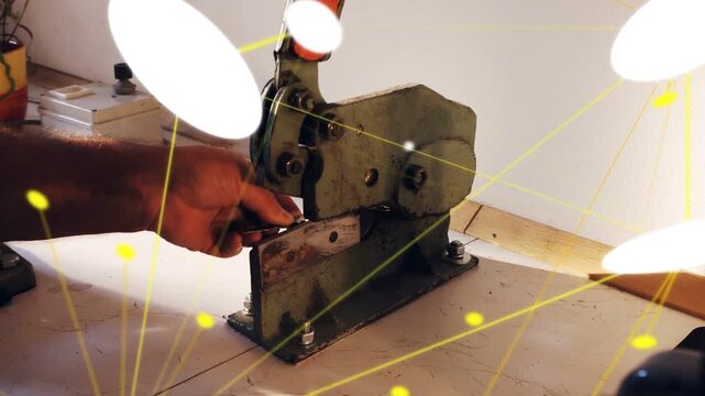 Tech pulling orange lever shearing part with snips white-yellow overlays hiding view for metalwork