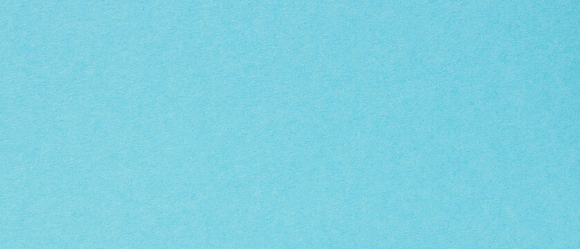 Light blue textured paper background with subtle fiber pattern for creative design