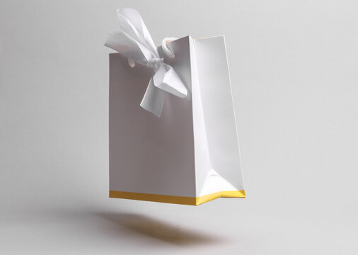 Premium white jewelry box bag with bow floating on white background