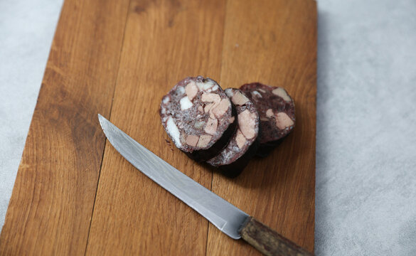 Blood sausage on a wooden cutting board