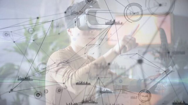 VR tester raising right hand and moving network HUD nodes in workspace, analyzing for tech testing