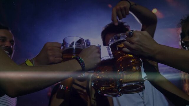 Friends raising beer mugs initiating toast, clinking over camera, celebrating club with lens flares