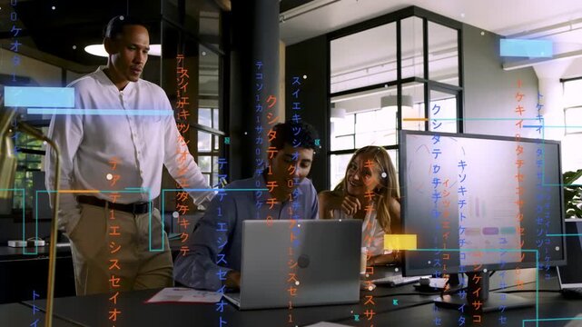 Standing lead initiating review, operator typing and colleague gesturing toward monitor for review