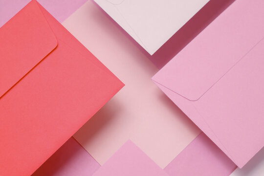 Set of floating envelopes and cards on pink background. Invitations, corporate identification