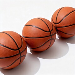 Fototapeta premium Three orange basketballs on white background