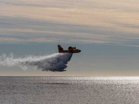 La Ciotat, France - 02 21 20202: Canadair CL 415 aircraft dropping water over Mediterranean sea