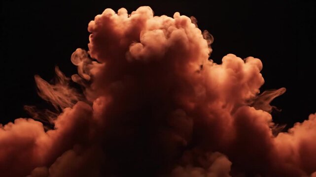 A large orange cloud formation against a black background.