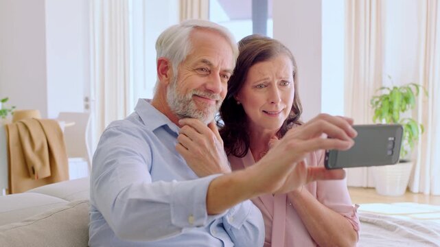 Mature, couple and wave with phone for video call, communication or goodbye on sofa in home. Man, woman and smile with farewell or good news on mobile smartphone for virtual chat or app in house