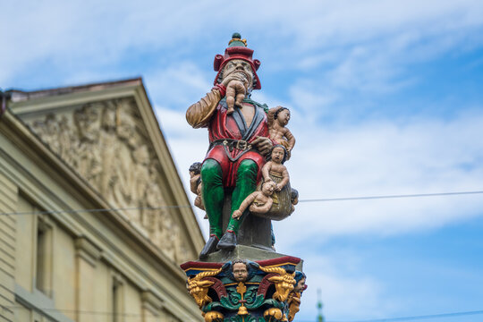 Bern, Switzerland - October 21, 2025 : Kindlifresserbrunnen painted stone fountain child eater statue at Kornhausplatz.
