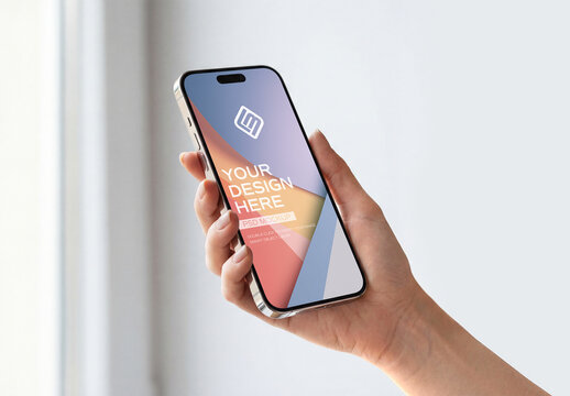 User Hand Holding Smartphone in White Interior Mockup